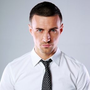 portrait-of-a-confident-man-over-gray-background-PDL3Q9F.jpg
